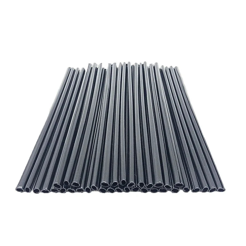 A bundle of motorcycle wheel rim spoke wrap kits, consisting of numerous thin, dark gray or black rods.