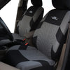 A close-up view of a black and gray car seat cover installed on a vehicle seat.
