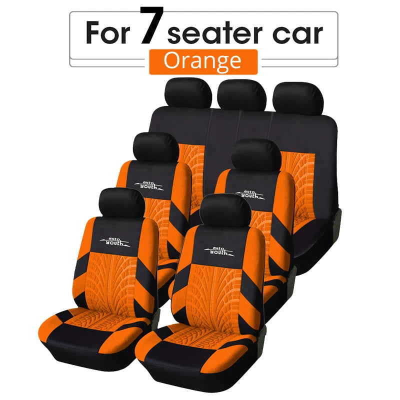 A set of orange and black seat covers for a 7-seater car.