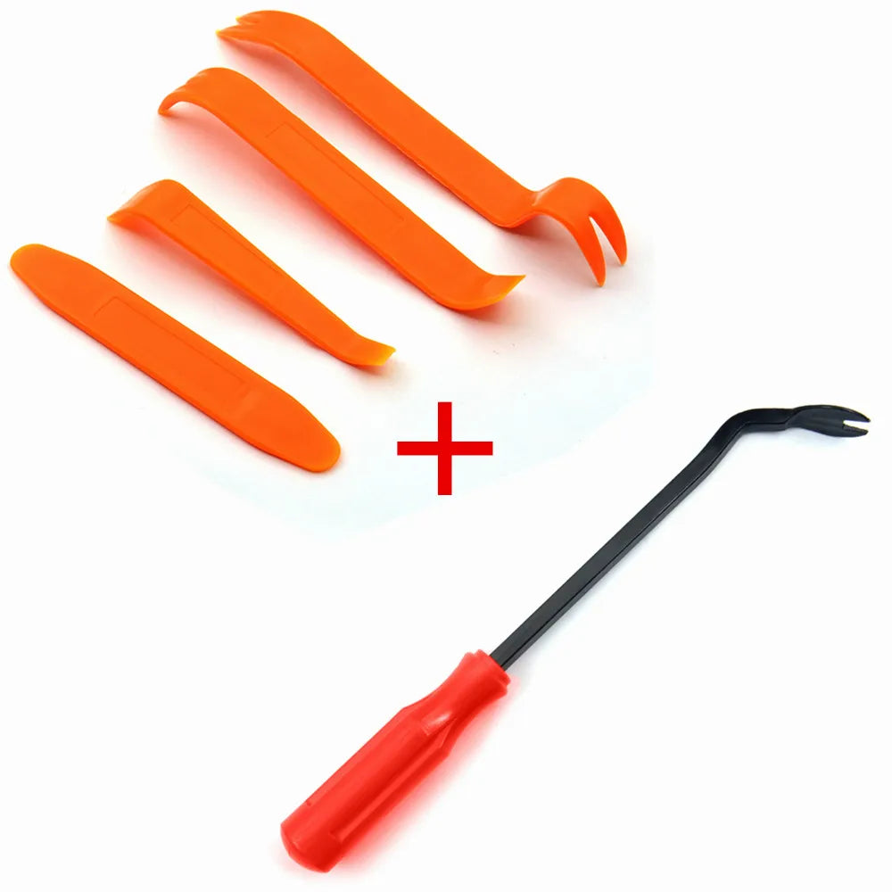 Orange car trim clip removal pliers and a black tool with a red handle
