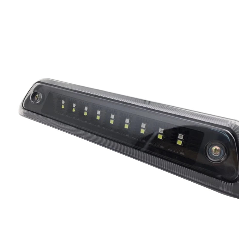 An LED third brake light assembly for a Ford F-150, featuring multiple bright yellow lights.