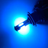A bright blue LED headlight bulb emitting a strong white light against a dark background.