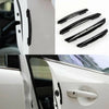 A set of four black anti-scratch guard strips for car door edges and trim.
