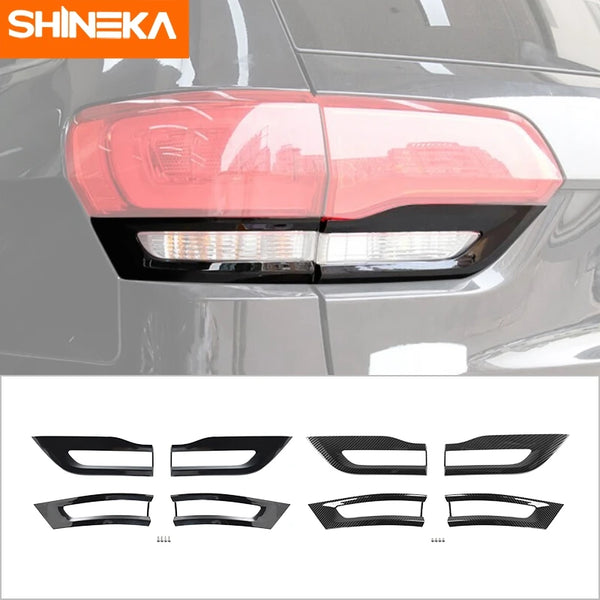 Black plastic tail light lamp guard trim for a Jeep Grand Cherokee vehicle.