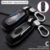 Black shell and special buckle car key cover with a silver keychain attachment
