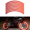 A black motorcycle with bright red reflective rim tape decals on the wheels.