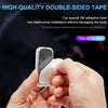 A hand is peeling a piece of double-sided tape from a car interior component.