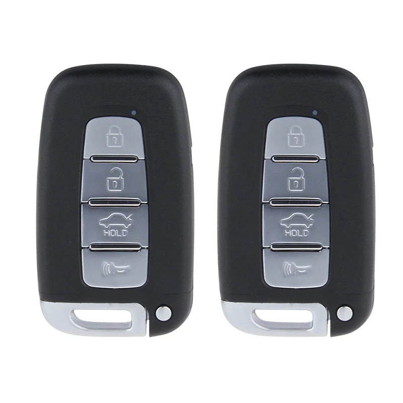 A pair of black remote engine start and keyless entry car alarm systems with multiple buttons.