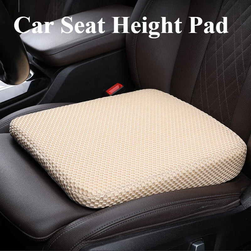 A beige honeycomb memory foam car seat height pad placed on a dark brown car seat.