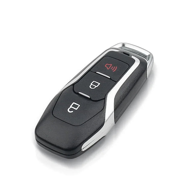 A black and silver key shell replacement case with a button and a key slot is shown from above.