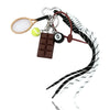 A sporty billiard bag charm keychain featuring a wooden puck, a tennis ball, and a magnifying glass attached to a leather str