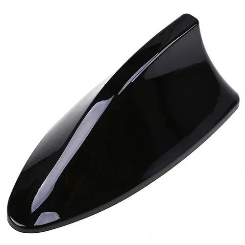 Glossy black shark fin decorative car antenna cover viewed from above