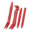 A set of red plastic tools for removing car trim.