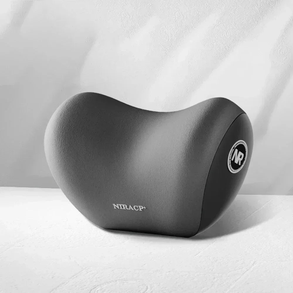 A gray ergonomic memory foam neck and lumbar pillow set resting on a white surface.