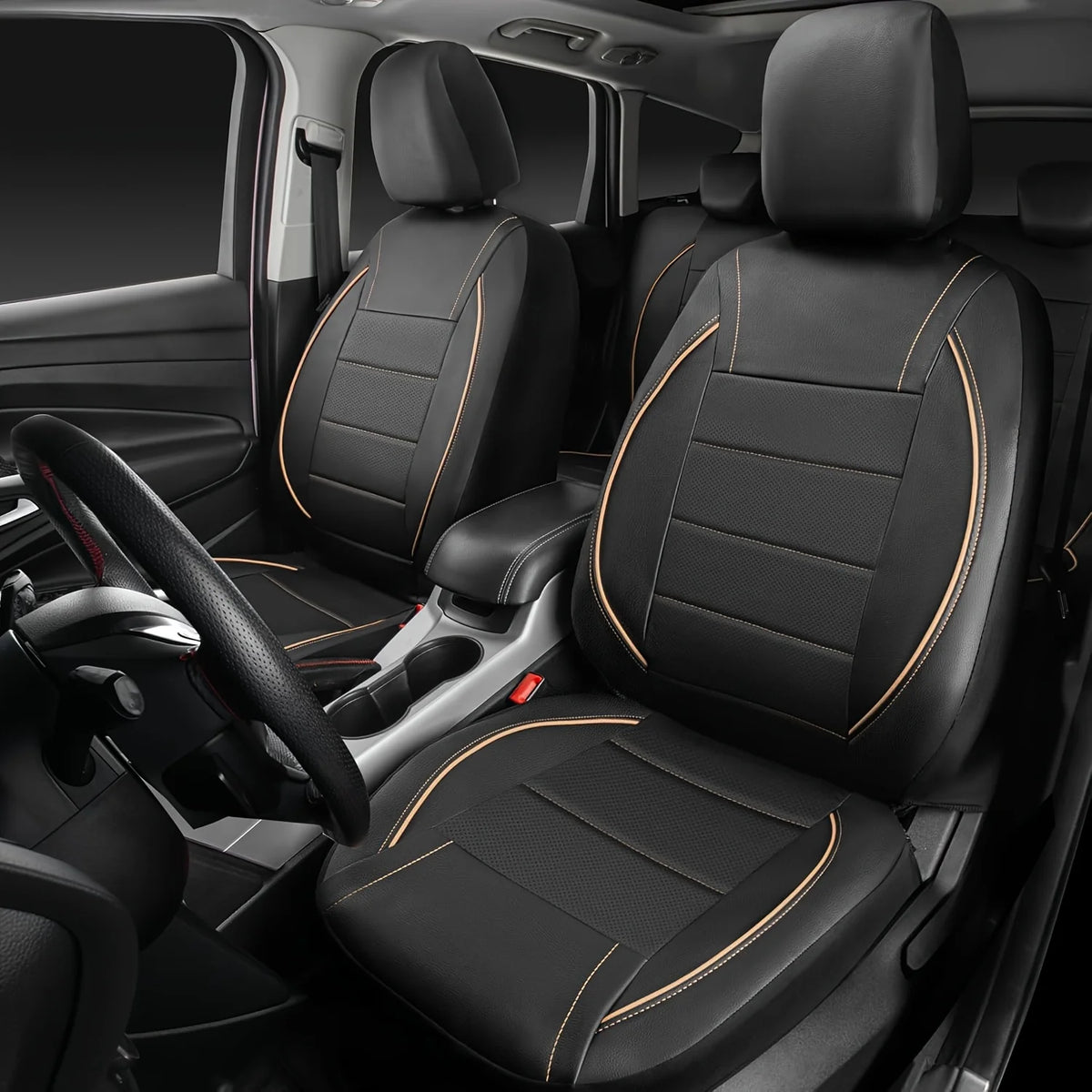 Interior view of a car showing black leather seat covers with orange stitching and a black steering wheel.
