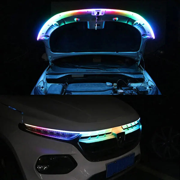 Close-up of an RGB LED light strip installed on the hood of a white car.