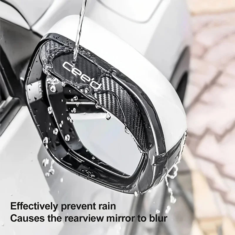 Carbon fiber rain shield protecting a car's rearview mirror from rain and blurring.