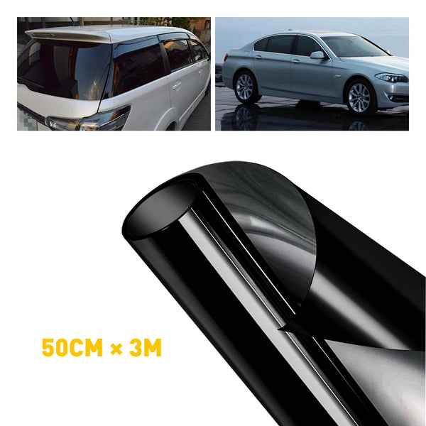 Roll of black window tint film for vehicle privacy, shown next to a car.
