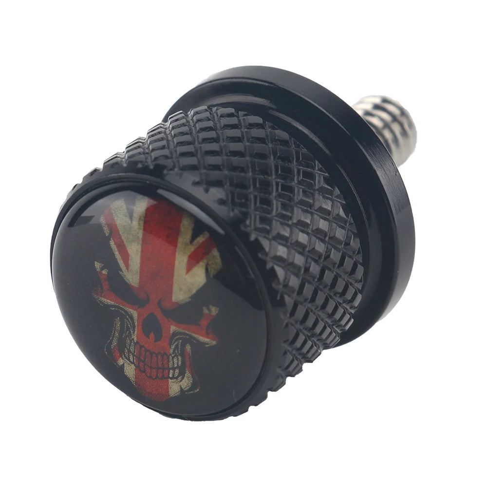 Black aftermarket motorcycle seat and fender bolts with a skull design
