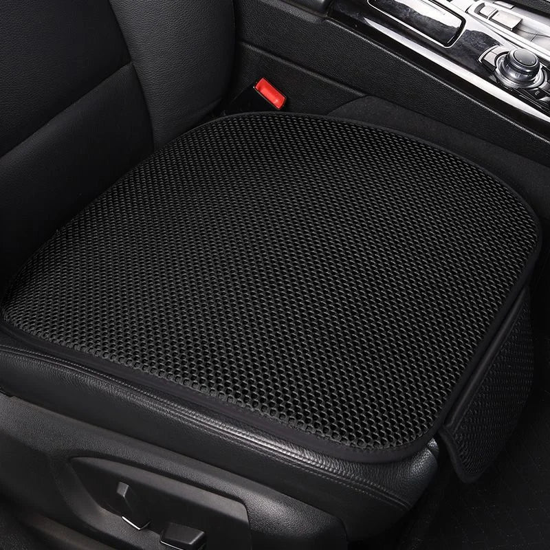 Black breathable ice silk car seat cushion placed in a vehicle interior.