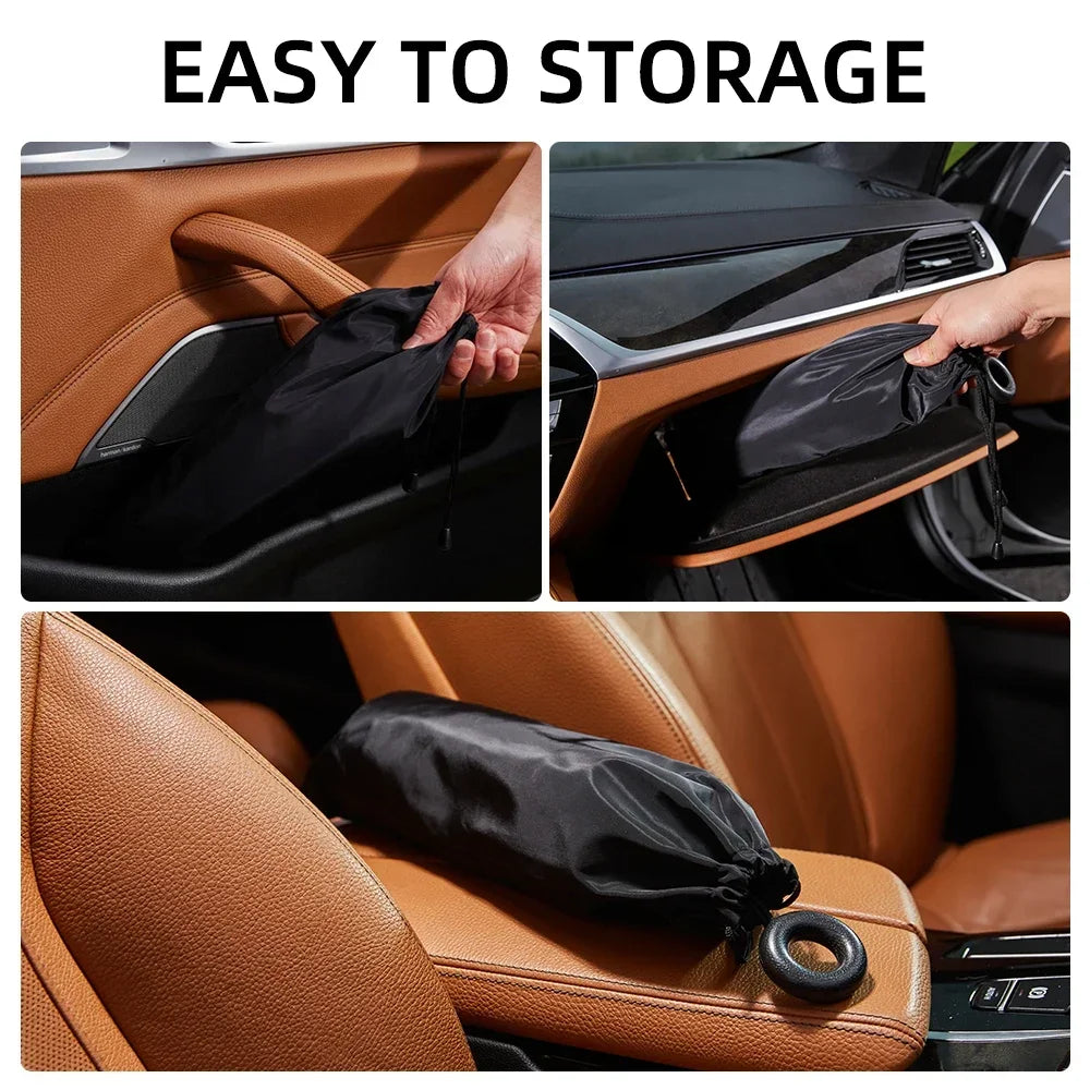 A black foldable car windshield sunshade is shown being easily stored in a car interior.