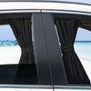 Black fabric curtains covering the side window of a car, viewed from the exterior.
