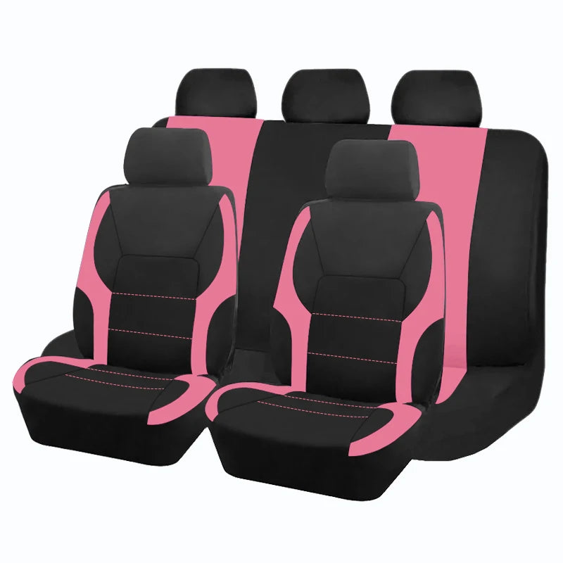 Ein Set aus fünf schwarzen und pinken universellen Autositzenbezügen in einer Reihe angeordnet.