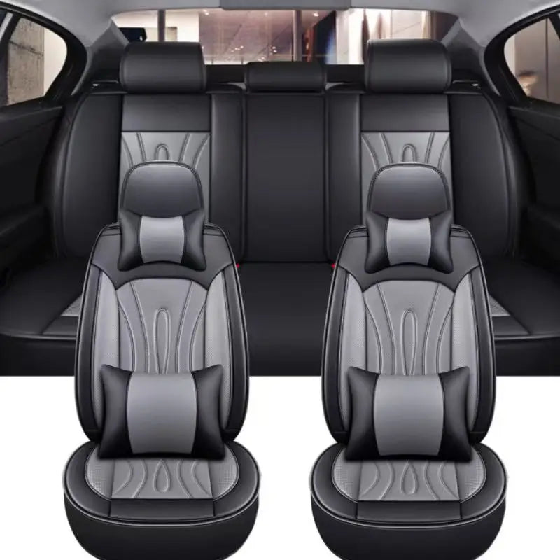 A pair of black premium PU leather car seat covers shown in a studio setting.
