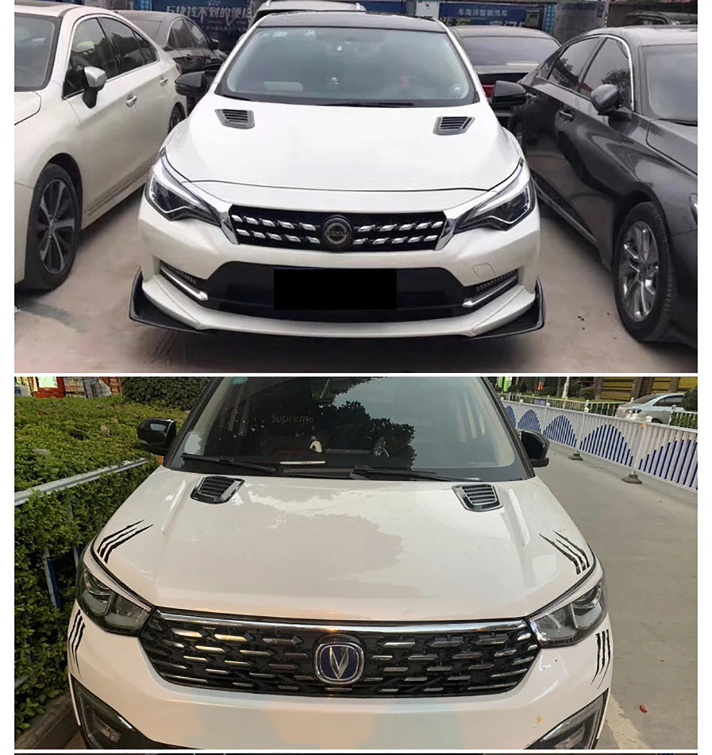 Close-up view of a white car's front grille and hood with carbon fiber trim details.