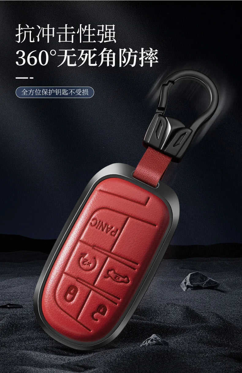 A red leather car key fob cover with a metal clasp is shown against a dark background.