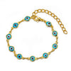 Gold plated evil eye charm bracelet featuring blue and white eyes set in adjustable link chain.