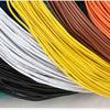 A close-up view of various colored heavy duty insulated copper power cables bundled together.