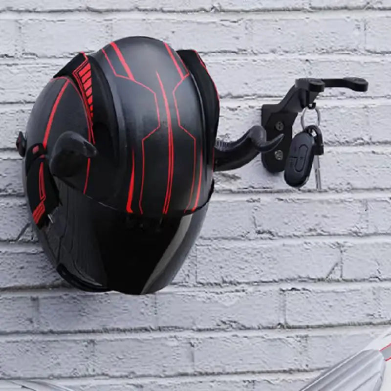 Black and red multi-sport gear wall mount hook with a clamp for hanging equipment