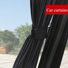 Black car curtains drawn on a side window, showing the fabric texture and mounting.