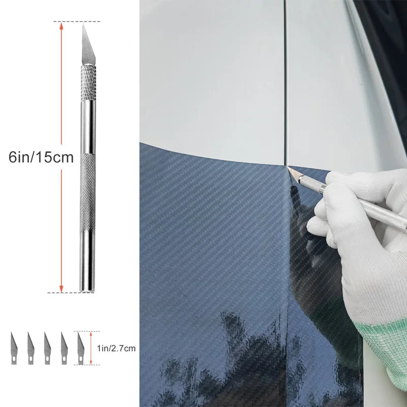 A hand uses a professional car window film installation tool to apply a dark tint film to a glass surface.