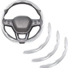 A carbon fiber steering wheel cover with a leather grip and buttons.