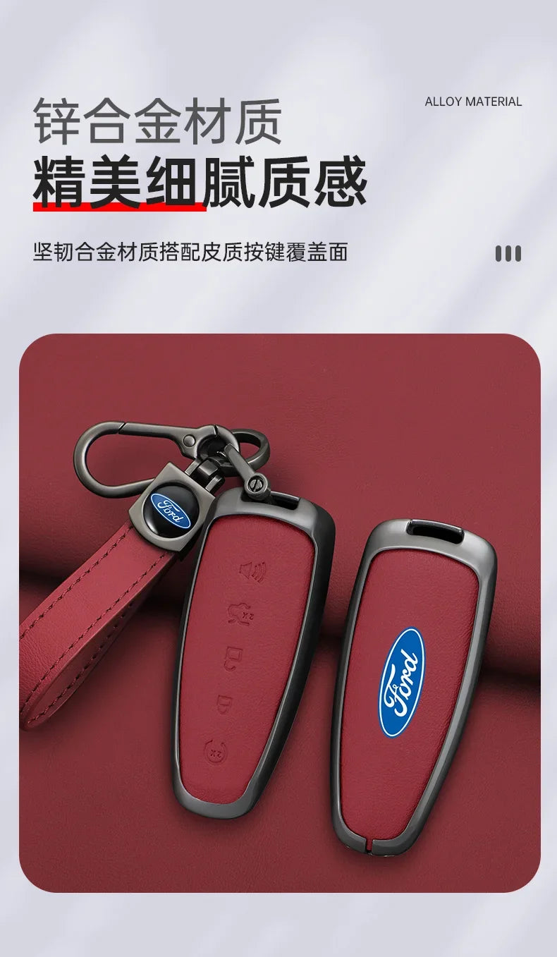 A close-up of a Ford car key with a leather cover and metal fob, resting on a dark red surface.