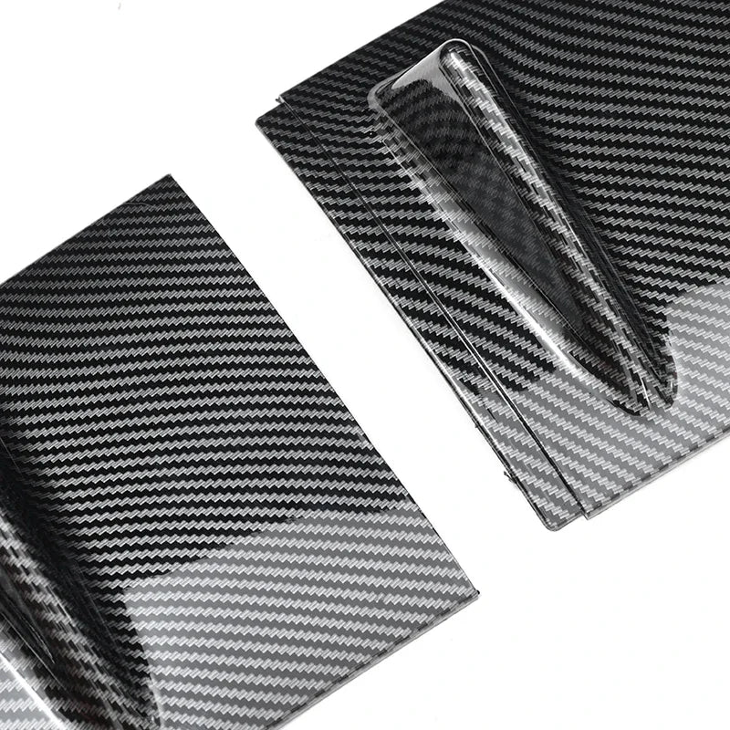 Gloss black rear bumper lip diffuser product shown in a folded, textured pattern.