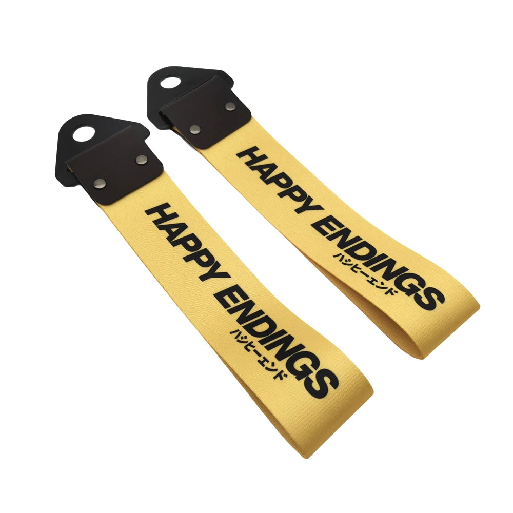 A yellow universal tow strap with black mounting brackets and text in English and Japanese.