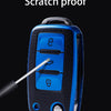 A blue TPU car key fob cover is shown with a scratch proof label, being touched by a metal probe.