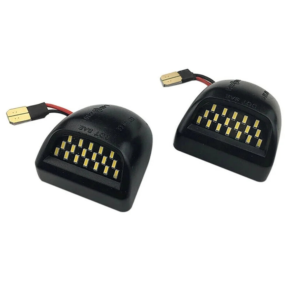 A black LED license plate light assembly with a connector cable and a bright yellow light array.