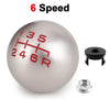 A silver aluminum ball shift knob with red markings for 6 speed gear selection, along with a mounting nut.