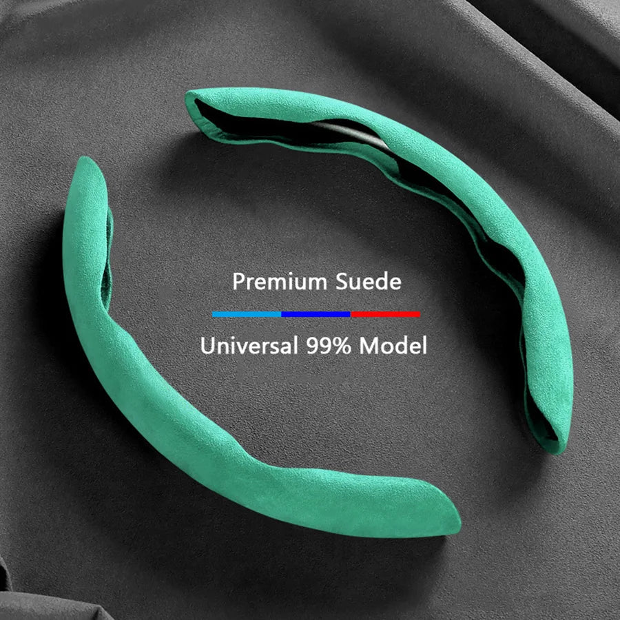 A teal suede steering wheel cover is shown against a dark gray background, highlighting its universal fit.