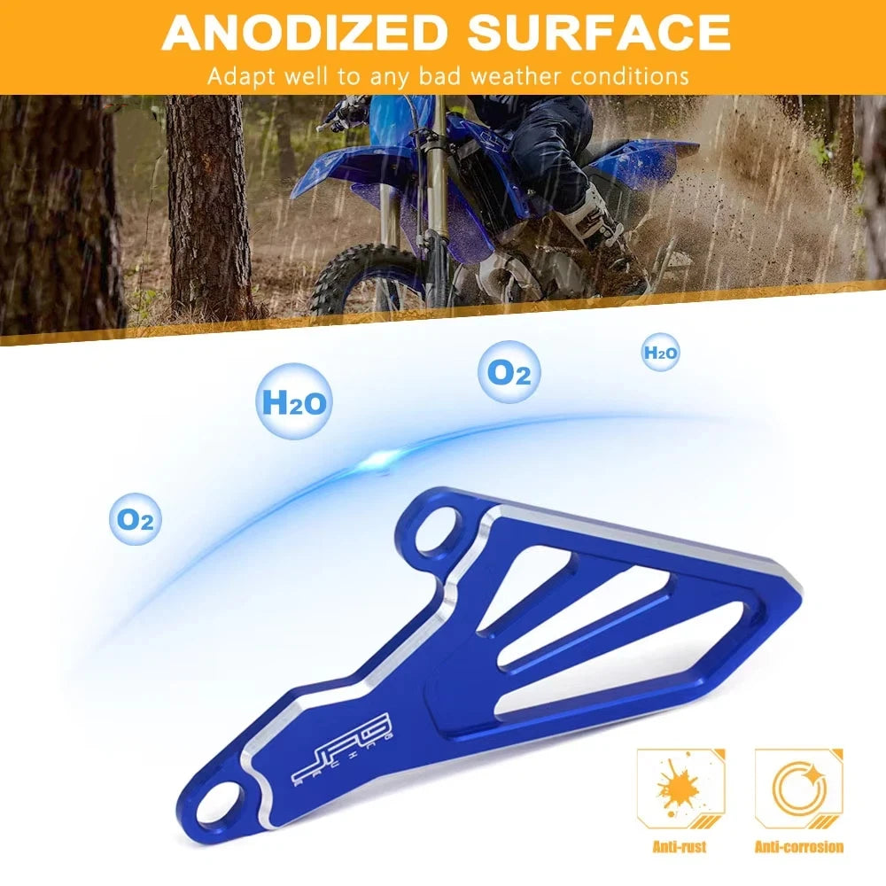 Blue anodized aluminum front sprocket cover for dirt bikes, showing anti-rust and anti-corrosion features.