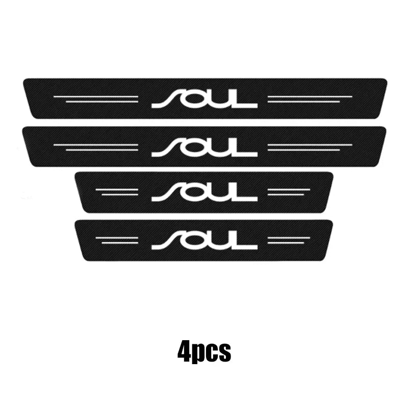 Four black carbon fiber door sill protectors featuring a custom SOL logo.