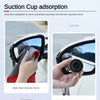 A suction cup adhesive film is shown being used to clean a car's rearview mirror.