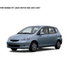 A side view of a light blue Honda Fit hatchback with aftermarket window visors installed.