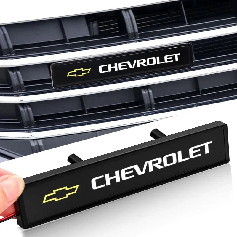 Black LED grille light for Chevrolet vehicles featuring a yellow bowtie emblem