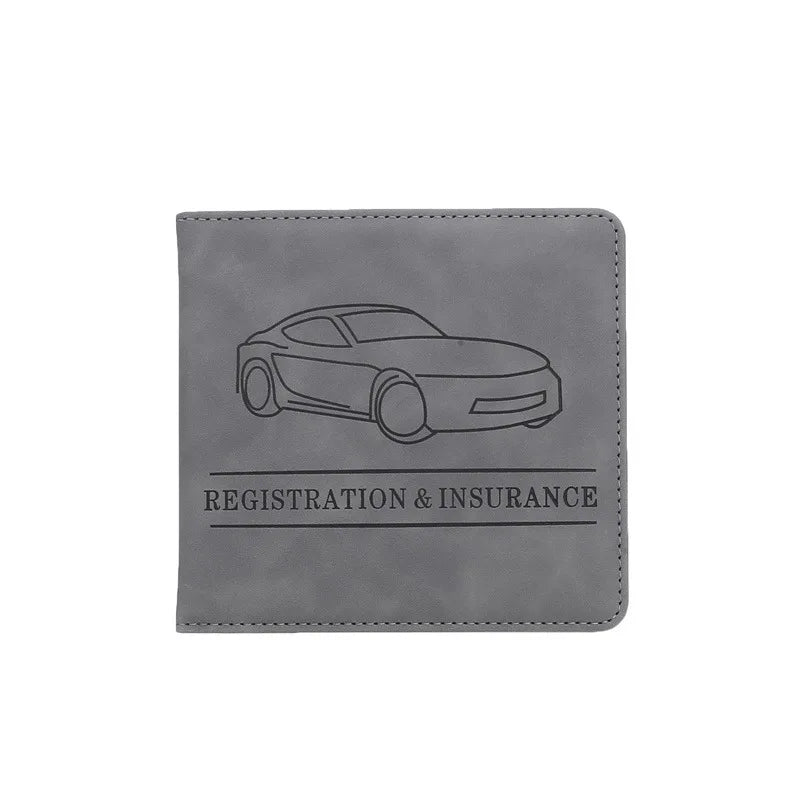 A gray leather document and ID holder featuring a silhouette of a car and the text Registration & Insurance.