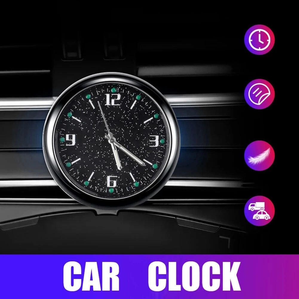A close-up view of a black stick-on car clock with a luminous display and various feature icons.